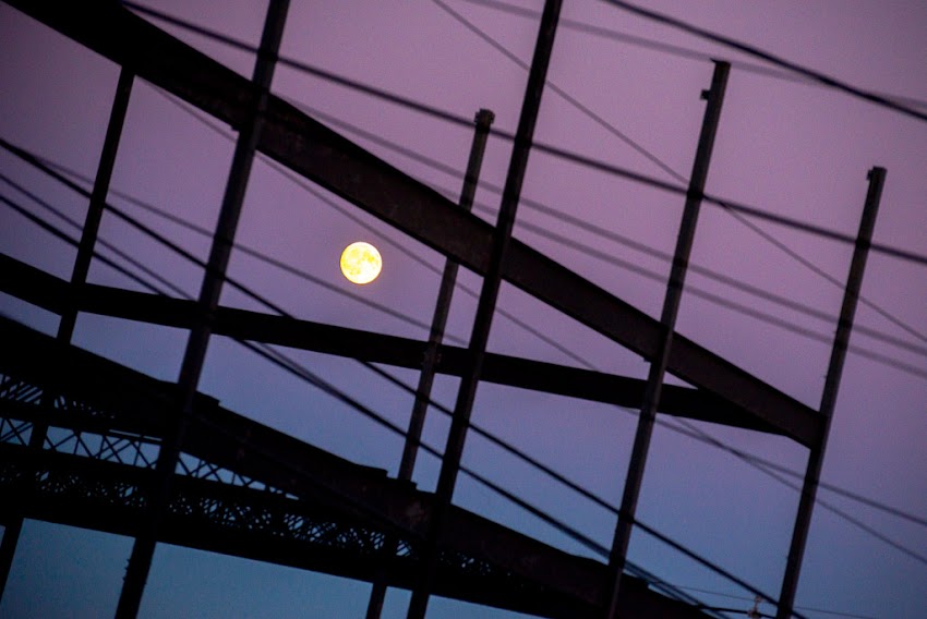 Portland, Maine USA October 2016 photo by Corey Templeton. An abstract view of the moon over a construction site at the corner of York and High Streets. 