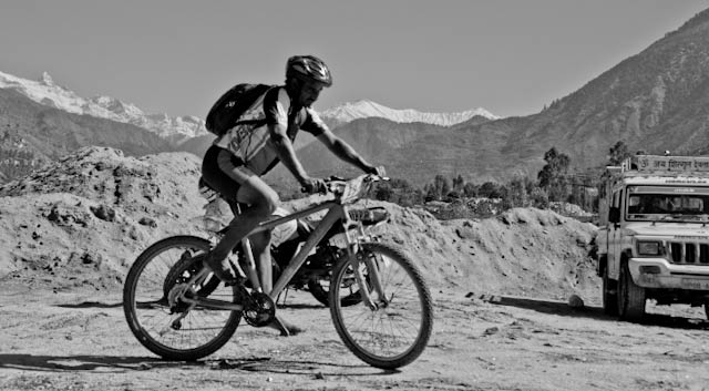 Bike Riding Activities during 8 days of Mountain Terrain Biking event of Himachal Pradesh 2010 : Posted by VJ SHARMA on www.travellingcamera.com :Its been more than 3 weeks that I am posting Photographs of Mountain Terrain Biking in Himachal Pradesh (2010) and today I thought of sharing photographs of Riders only... Please check the Photographers of most of the riders who participated in MTB Himachal 2010...Some of them are in silhouettes to make that snow covered hills are noticeable in the photographs....Riders on highest speed during downhill stretch of MTB Himachal 2010...Bhago Bhago.... MTB Riders aa rahe hain... A Call by one of the Photographer to others standing on next turns of the same road...Here comes Rider Number 41 of MTB Himachal 2010... Who is he?All the riders were very skillful and had to cross many challenges on the way... Roads, Traffic, Weather etc...Flying Riders of Mountain Terrain Biking event of Himachal Pradesh (2010)Mr Ranjan Nautiyal in Downhill during third day of MTB Himachal 2010....One of the rider from Banglore who were sponsored by Royal Challenge...Here comes another passionate rider of MTB Himachal 2010.. He was from Maharashtra Police and had participated in Common Wealth Games 2010 in Delhi...A Passionate rider from Dehradun.. Mr. Ranjan Nautiyal !!!Dutta Ji !!! Another Rider of MTB Himachal 2010 - with his unique style... He never wear shoes and most of the time rode the bike bare feet... Dutta Ji is a farmer in Maharshtra state of India....Delhite Rider @ MTB Himachal 2010 ... a Nepali Rider talking to air in Himalayas @ MTB Himachal 2010 !!!Me standing with Nepali Team @ Jalori Pass, in front of Banjar mountain range which was covered of snow...Riders in the beginning of fifth day after a good stay at Kullu Sarahan Village @ 3200 meters...One of the rider starting from Kullu Sarahan Camp on Fifth day of MTB Himachal 2010 !!Mr Suresh, A rider from Maharashtra cleaning his bike during rest day @ Kullu Sarahan Village...Rider no 2, I think he is Rohitash from Banglore :)MTB Himachal riders repairing their bikes @ Baghipul...Riders struggling to ride during hike & bike session on second day !!!Riders dragging their bikes in hiking stretch on second day of MTB Himachal 2010...Another Rider dragging his bike on second day of Mountain Terrain Biking @ Himachal PradeshMTB rider crossing the natural obstacles... on second day of Mountain Terrain Biking event in Himachal Pradesh....Unique style of riding the bike on straight hill on second day of MTB Himachal 2010....Riders during Hike and Bilke Stretch on second day after camping @ Shainj Village in Shimla District..Every rider had to cross a river on second day of MTB Himachal 2010... But here is one enthusiast who is having fun inside the river with chilling water...Another rider crossing the river during second day of Mountain Terrain Biking in Himachal Pradesh.. 2010He also wanted to save his shoes from water :)MTb Rider about to hit the final line...Another MTB rider struggling hard to reach the final line...MTB RIDERS crossing water stream on the way...Riders crossing through various villages on the way ....Rains had added more excitement among riders..Uphill Stretch during first day of Mountain Terrain Biking in Himachal Pradesh... 2010Its evening time now... and next destination is still far away....