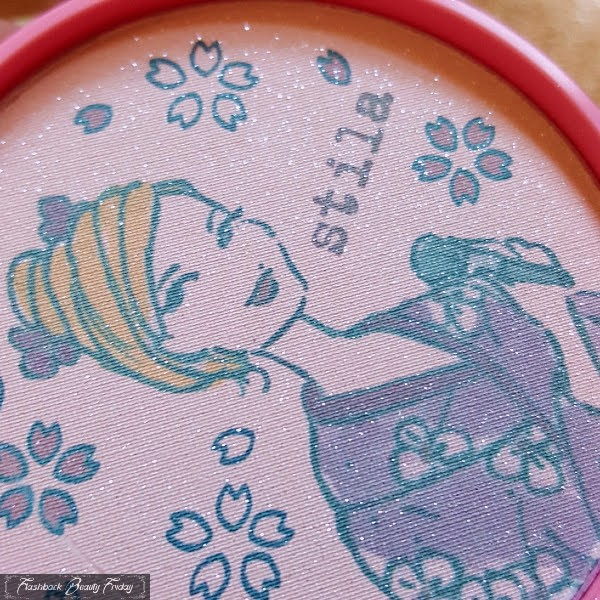 close up of sparkling face powder with kimono girl illustration on surface