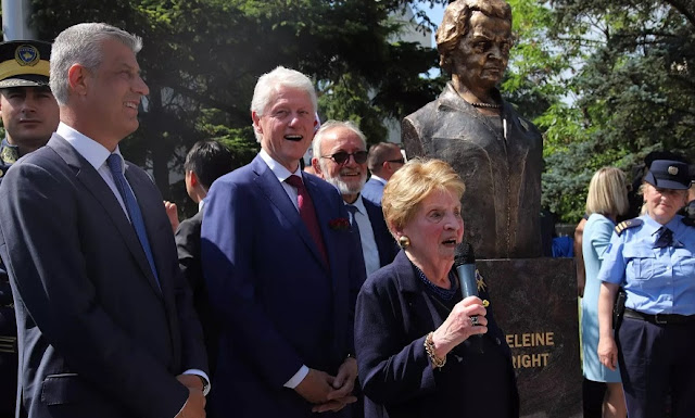 Bill Clinton and Madeleine Albright with a statue erected in her honor in Pristina