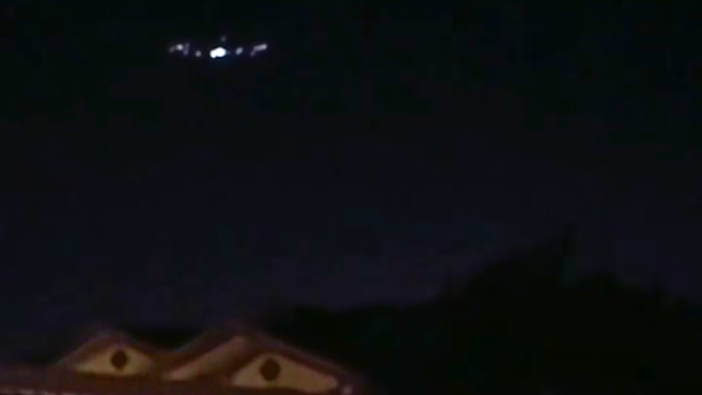Unbelievable UFO sighting on CCTV hovering over people's homes.