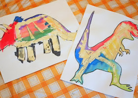 tape resist dinosaur bone paintings- great stem and art project for kids