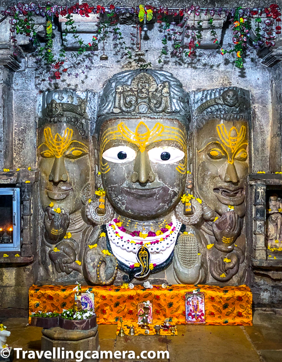 The sanctum of the temple contains an image of Shiva. The image depicts Shiva as having three heads and all of them are shown wearing jata-mukutas. Each of the three faces of Shiva idol has a third eye and the face on right bears a terrifying expression. Centre and the left faces of Shiva idol show peaceful expression.