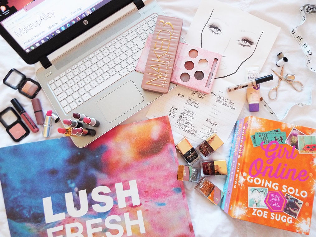 Flatlay of old school beauty blogging makeup products, beauty gurus and websites, encompassing my journey as to why I started blogging.