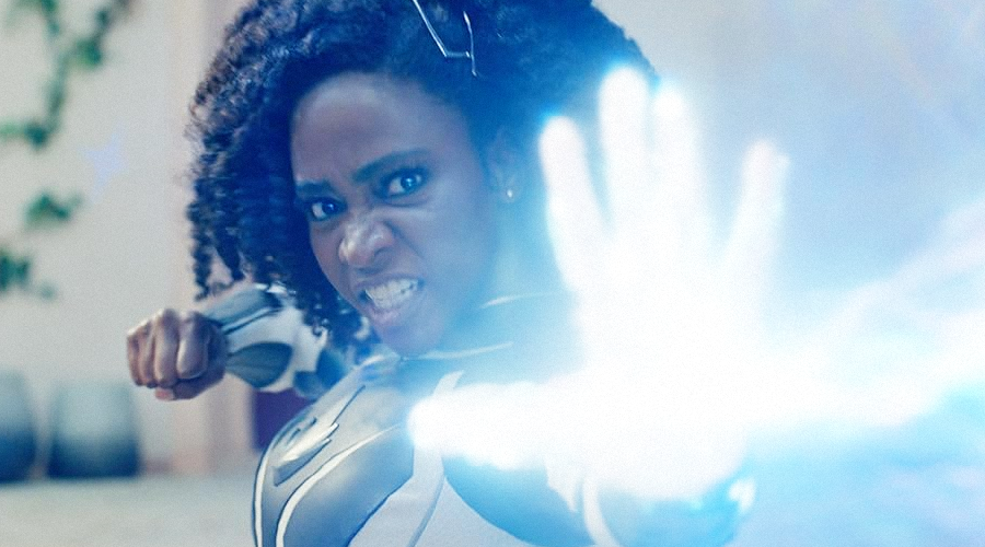 Teyonah Parris as Monica Rambeau, blasting light energy out of her hand during a battle on Aladna..