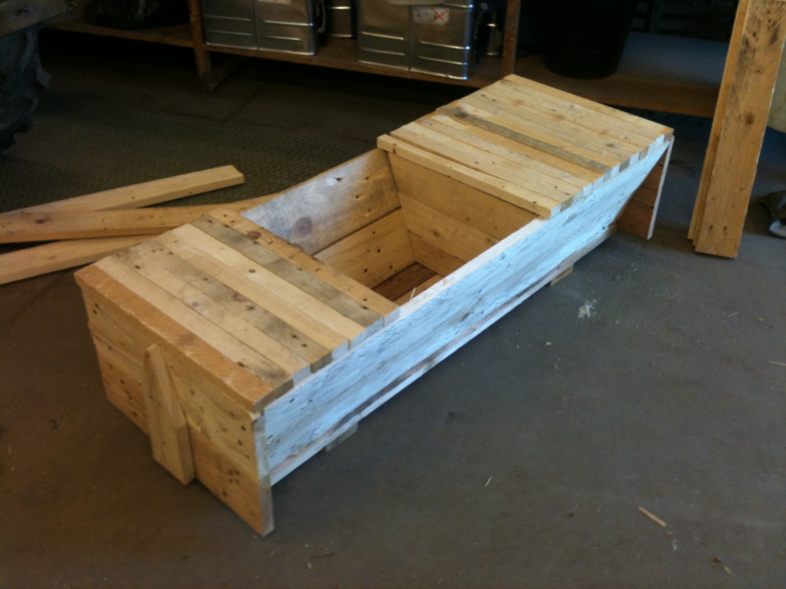 The finished top bar hive body with a follower board in place and some 