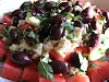 Watermelon & feta salad amongst olives