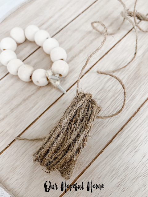 wooden bead ring with jute twine tassel