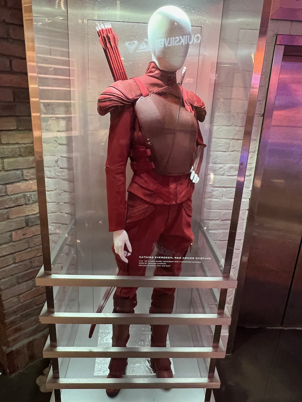 Hollywood Movie Costumes and Props: Jennifer Lawrence's Katniss Everdeen  red armour from The Hunger Games: Mockingjay Part 2 on display...