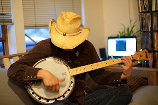 a man plays a banjo