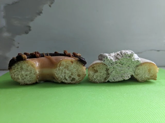 Cross-section of Krispy Kreme Caramel Brownie Donut and Cinnamon Latte Donut.