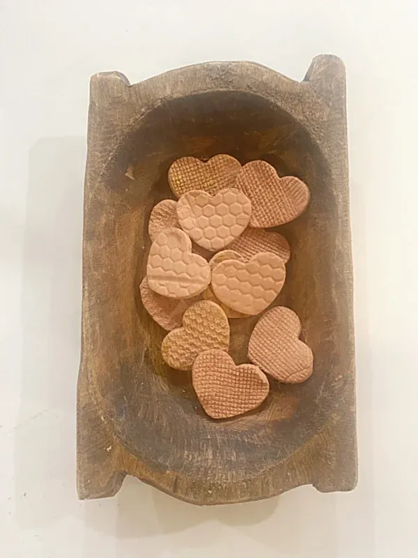 bowl of brown textured clay hearts