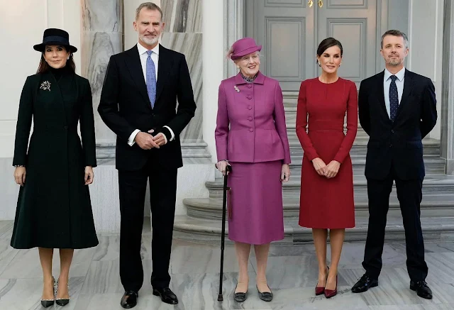 Queen Letizia wore long belted wool coat by & Other Stories. Crown Princess Mary wore a green coat by The Fold