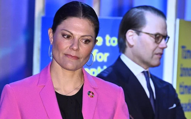 Crown Princess Victoria wore a tailored buttoned fuchsia blazer by Zara, and fuchsia full length pants by Zara. By Malina