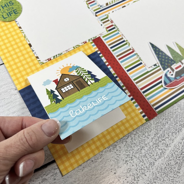 12x12 Lake Life Scrapbook Page with a cute cabin folding card
