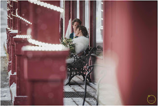 bride and groom enjoying a moment on a bench