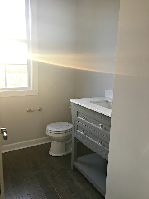 gray vanity with open shelf