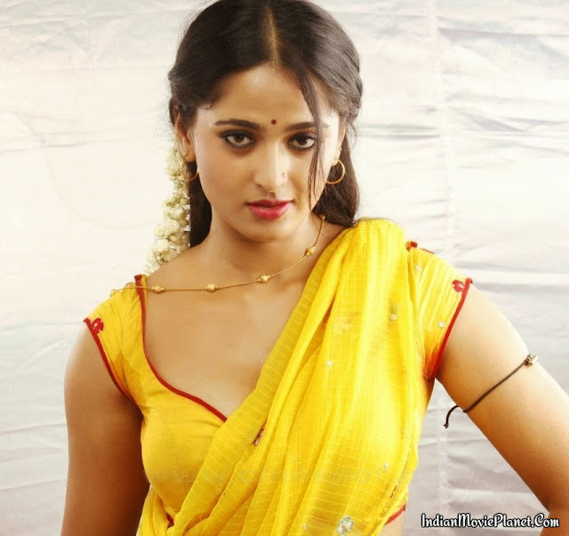 anushka shetty navel showing yellow saree stills