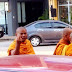 Monk raises middle finger to a man who refuses to make donation