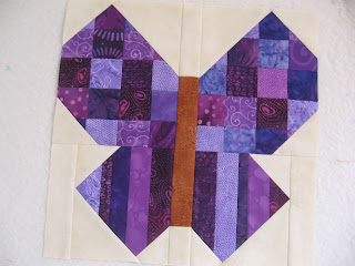 Purple scrappy butterfly quilt block