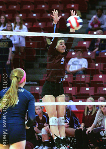 Parker Francisco goes up for a block at the net