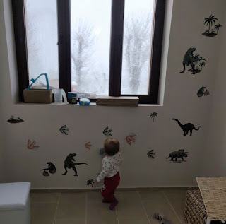 Rosie and her dinosaur wall