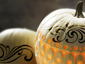 white carved pumpkin with black detail design