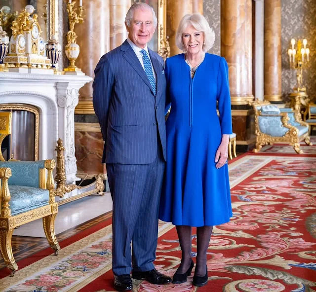 The Queen wears a blue wool crepe coat dress by Fiona Clareand the Queen Elizabeth's pearl drop earrings set