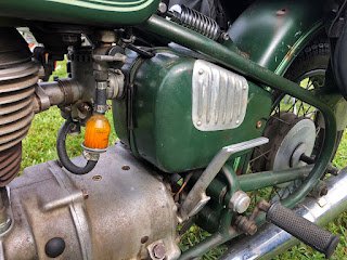 Grille on inlet for motorcycle carburetor.