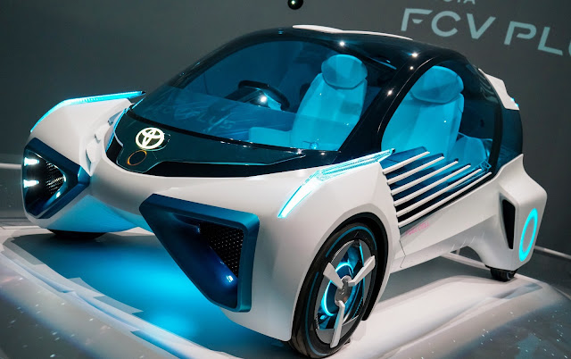 Toyota Motor Corp., Koji Sato, Electrification strategy, Carbon emissions, Electric vehicles (EVs), Hybrid vehicles, Decarbonization, Fuel cell vehicles, Hydrogen-powered vehicles, Sustainable transportation, Climate change, Commercial vehicles, Hydrogen consumption, Craftsmanship ethos, Automotive innovation, Environmental responsibility, Automotive future