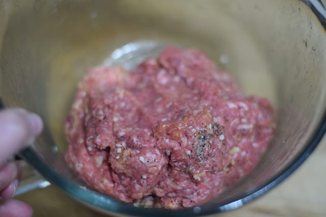 The salisbury steak meat mixture combined in the mixing bowl. 