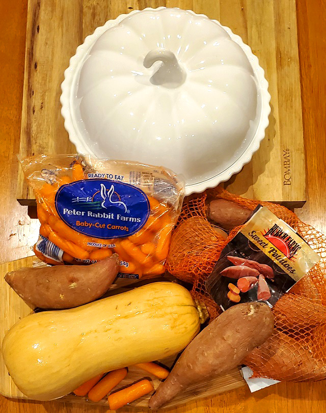 pumpkin serving dish with ingredients to make maple glazed carrots