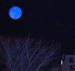 blue orb in sky