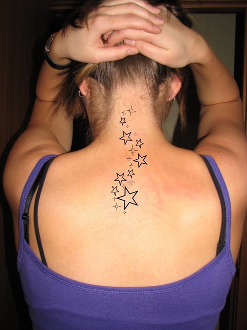 The lighter hues of purple around the shooting star tattoo may also convey a