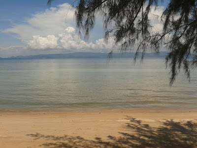 Elephantine humps of the Koh Samui hills in the distance