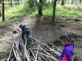 Children playing on a stream in the forest