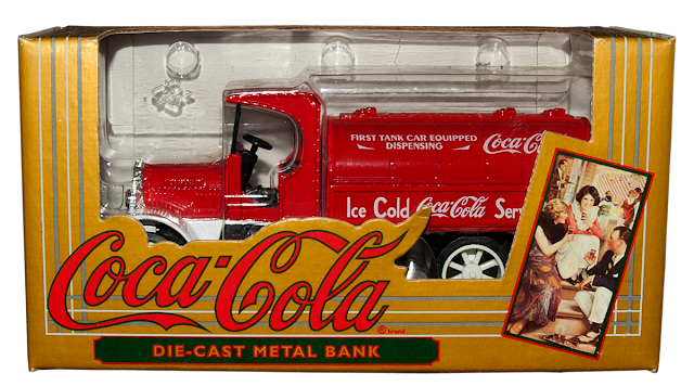 A collectible truck bank from Ertl with the Coca-Cola logo.