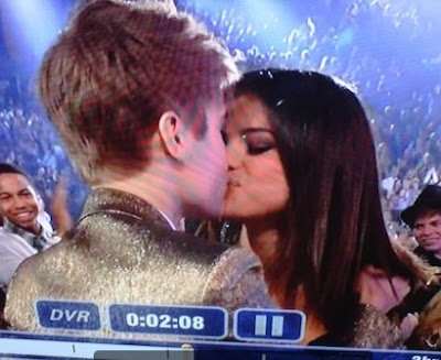 justin bieber and selena gomez kissing at the billboard awards. With Eminem absent, Bieber