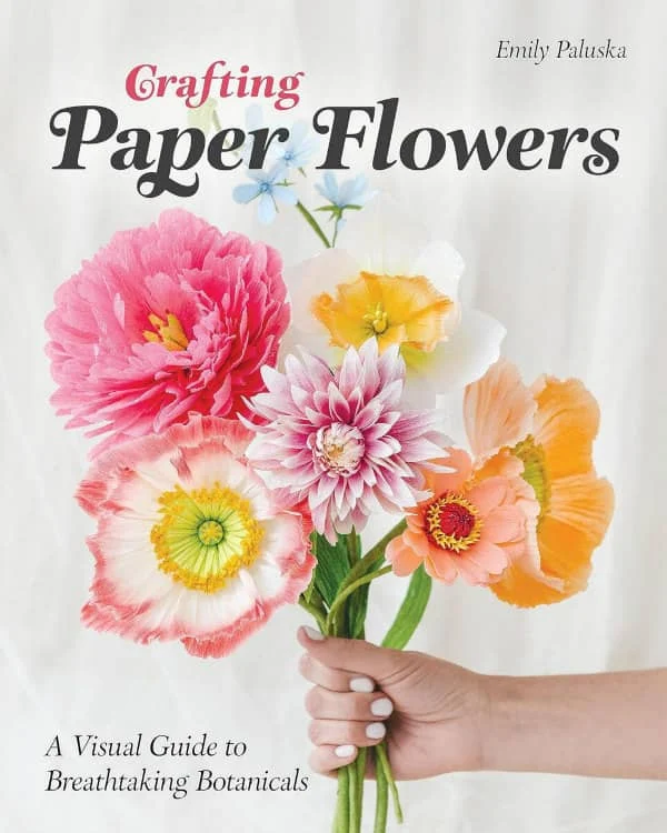 book cover shows hand holding out a bouquet of multi-color flowers