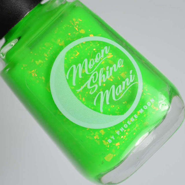 bright green nail polish with flakes in a bottle