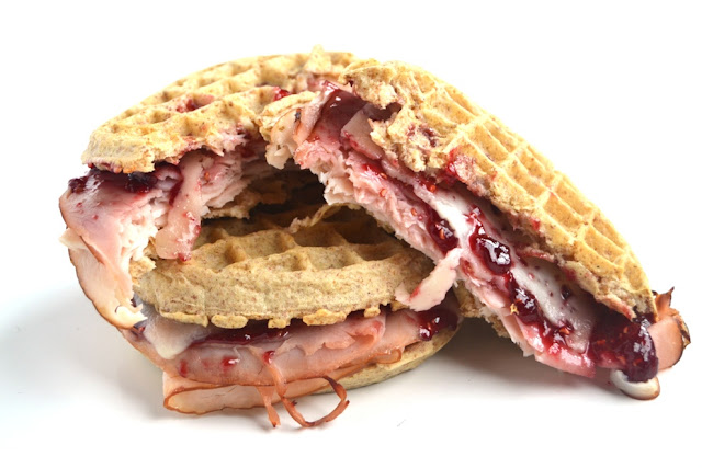 Monte Cristo Waffle Sandwiches only have 5 ingredients and take just 10 minutes to make! The perfect blend of sweet and savory with melted Swiss cheese, raspberry jam, turkey and ham on crispy whole-grain waffles. www.nutritionistreviews.com