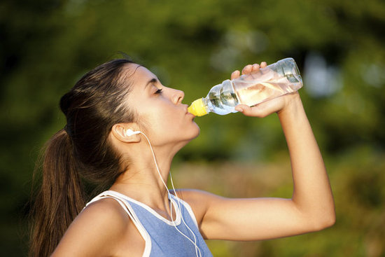 girl-drinking-water-from-bottle-to-stay-healthy-and-fit