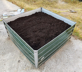 Full raised bed with soil and compost