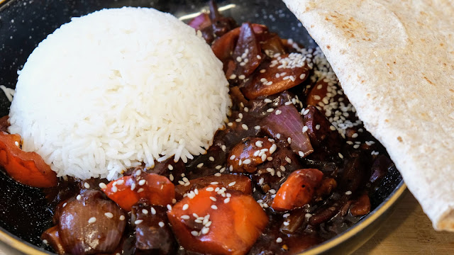 Lime and soya tofu with plain white rice covered in seseme seeds