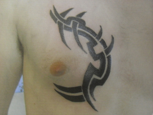 black tribal chest tattoo