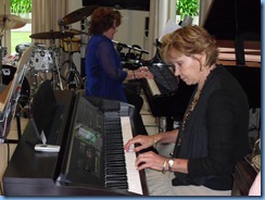 Joy Eade in piano heaven on the grand piano with Carole Littlejohn accompanying on the Clavinova CVP-303