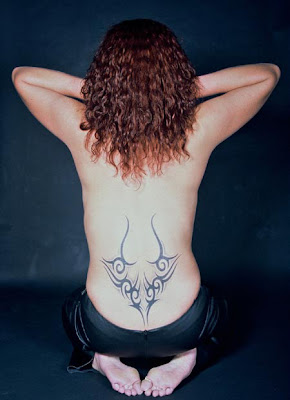 tribal horns lower back tattoo
