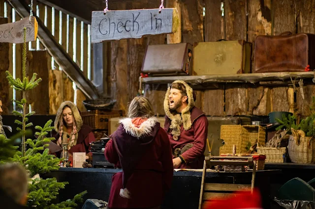 Elves at passport control ready to check everyone in to The Marsh Farm Father Christmas Experience