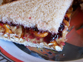 Peanut butter and jelly sandwich with pretzels
