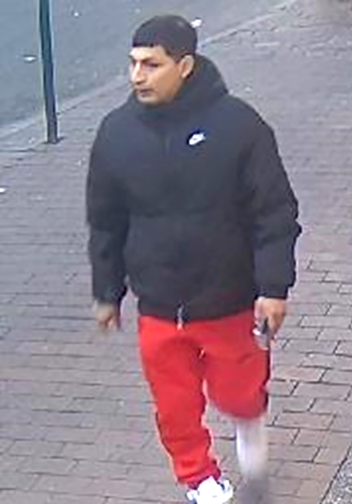 The NYPD is searching for this man in connection with a violent purse snatching in Queens. -Photo by NYPD